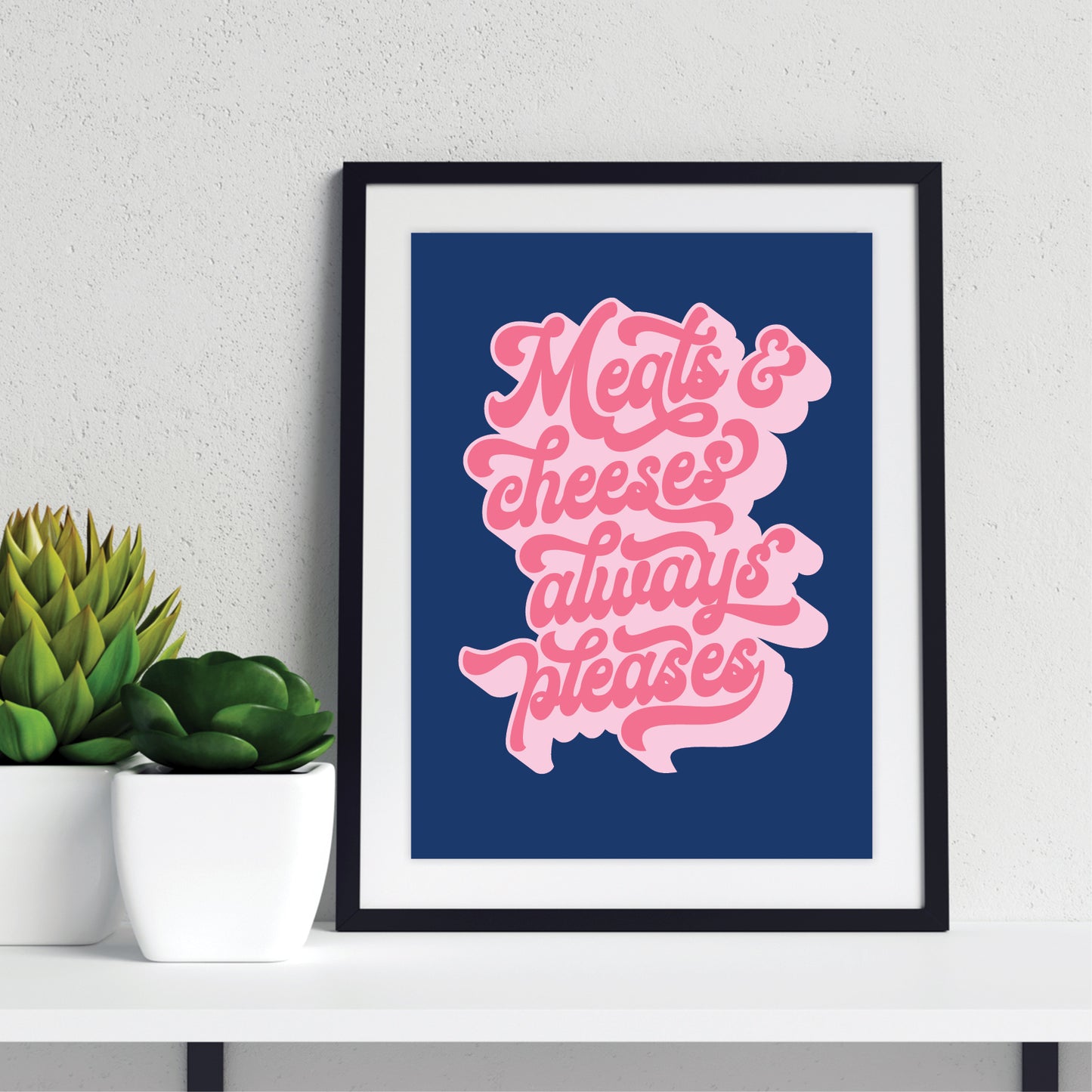 Art Print Pink text 'Meats & cheeses always pleases' on a blue background in a black frame with mount